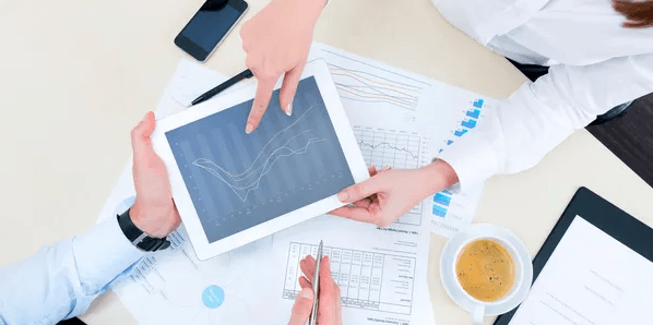 Consultants reviewing business analytics together